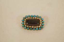 A Victorian hair panel turquoise and split pearl mourning brooch the glazed rectangular panel