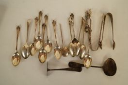A matched set of twelve silver tea spoons and a pair of sugar tongs by J Round, Sheffield 1920 -