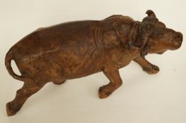 A wooden oriental carving of water buffalo, signed