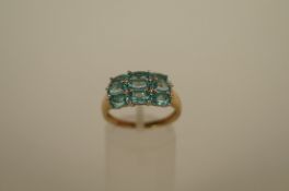 A nine stone blue topaz 9ct gold dress ring, finger size, O1/2, 2.9g gross