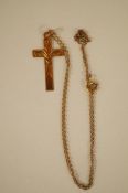 A 9ct gold engraved cross pendant on a chain, the cross 3cm long, the chain 41cm long, 1.9g gross