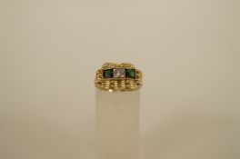 A three stone green tourmaline and diamond 14ct gold dress ring, the single cut diamond flanked