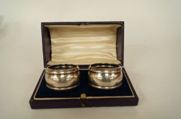 A pair of silver napkin rings by H W L