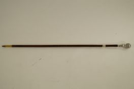 A Malacca cane with silver collar