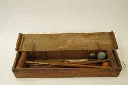 A croquet set in pine box