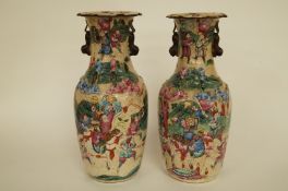 A pair of Japanese vases with battle scenes