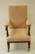 A 20th century mahogany armchair with turned legs