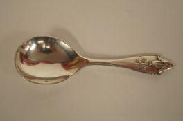 A Georg Jensen Akkeleje pattern silver caddy spoon, Georg Jensen dotted oval marks and  '925s'