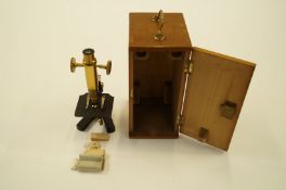 A cased microscope, Pillischer London and various slides