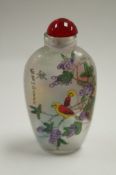 An oriental snuff bottle decorated with swans