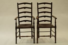 A pair of ladder back oak chairs