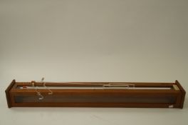 A Griffin and George display case for a barometer