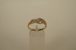 A ten stone diamond 14ct gold dress ring, the single cut stones arranged in two cross over rows,