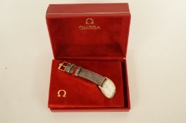 Omega De Ville, a gentleman's quartz, wristwatch, the rounded rectangular cream dial with black