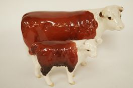 A Beswick Hereford cow and calf