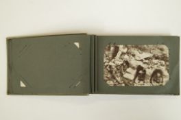 Postcard album containing various WWI postcards, German, French etc.
