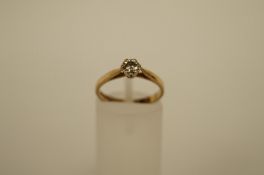 A diamond single stone 9ct gold ring, the mirror set brilliant of approximately 0.2cts estimated,