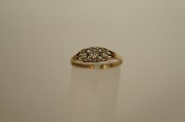 A three stone cubic zirconia 9ct gold ring, finger size N, 1.2g gross