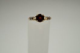 A garnet single stone dress ring, stamped '14k' finger size N, 1.3g gross