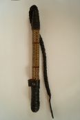 A vintage authentic leather camel whip