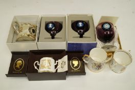 A collection of Wedgwood commemorative mugs, along with various others
