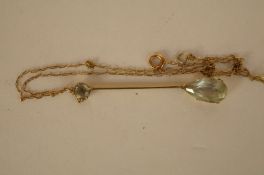 An Edwardian aquamarine pendant, the pendeloque cut stone, 15.5mm long to a bridge edge