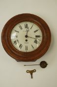 A 20th century French oak cased wall clock, dial marked "E. Faucon, Paris"
