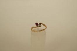 A diamond and ruby two stone crossover ring the brilliant cut of approximately 0.1cts estimated,