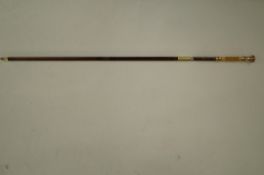 An ivory and gold plated slim walking cane
