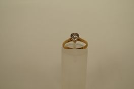 A diamond single stone 18ct gold ring the brilliant cut of approximately 0.05cts estimated, to a