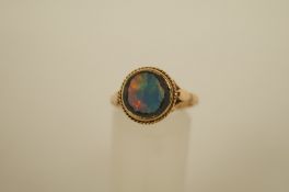 An opal double dress ring, stamped 9ct, finger size Q, 3g gross