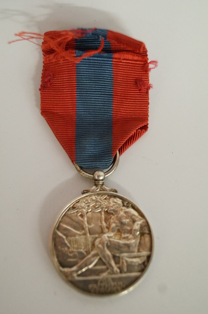 A WWII British for faithful service medal, awarded to Richard Edward Dunn