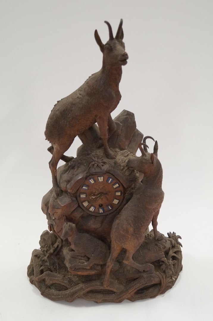 A 19th century carved Black Forest clock