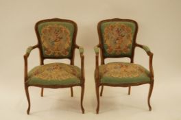 A pair of French style armchairs