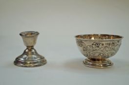 A silver bowl and a silver candlestick