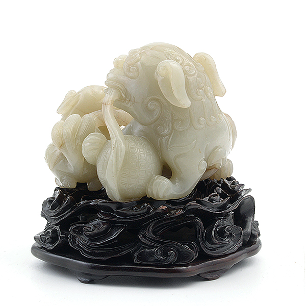 A Jade Buddhist Lion Group Portraying an adult playfully contending for a ribbon or tuft of smoke - Image 2 of 5