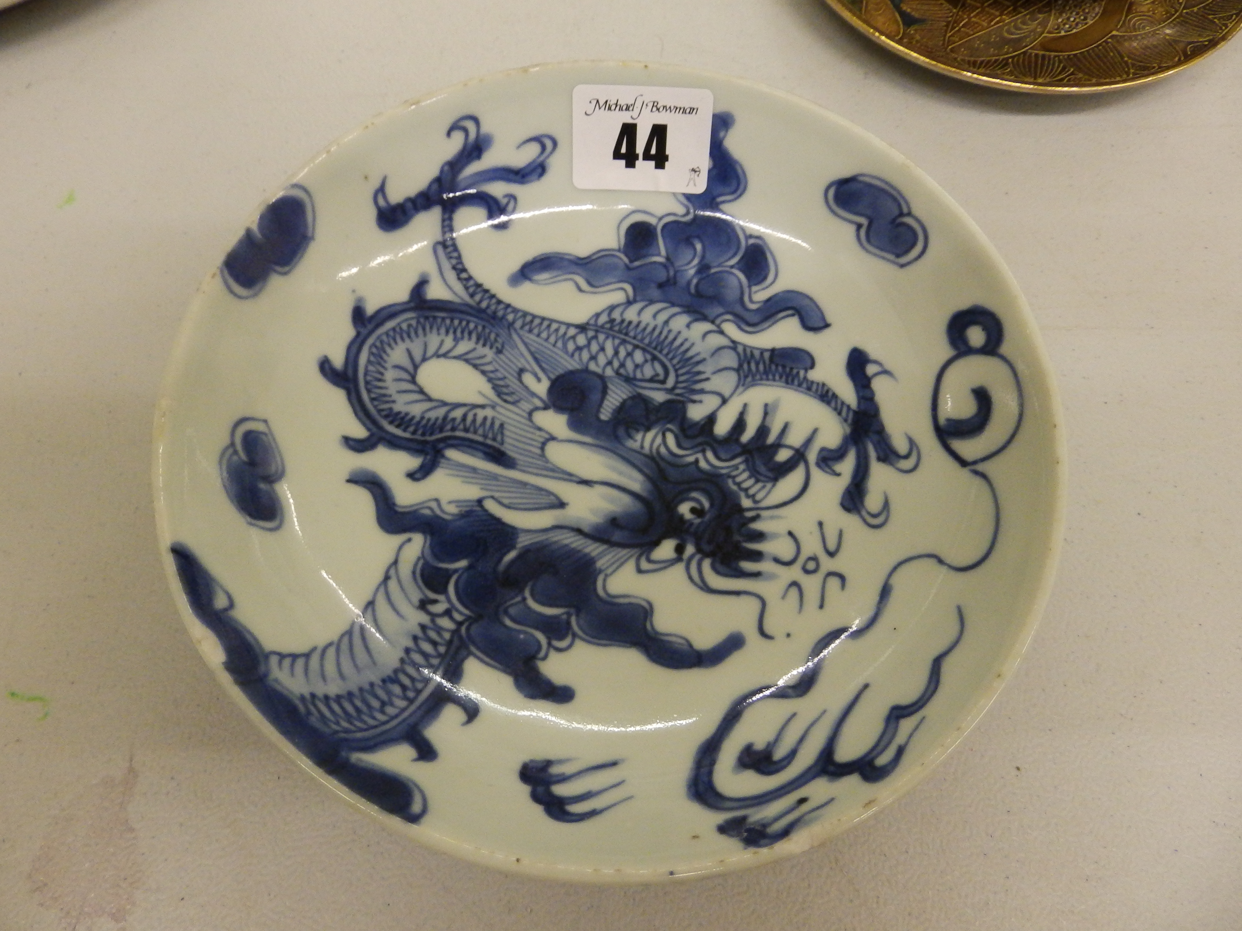 A small late 19th/early 20thC Chinese blue & white dragon dish