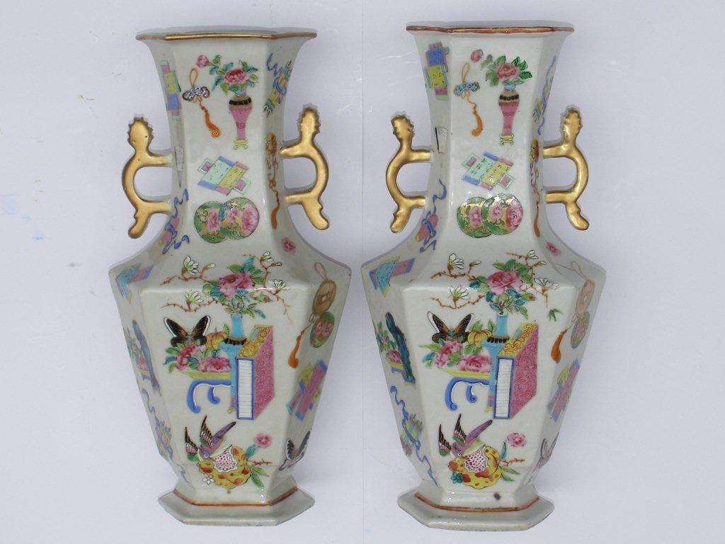 A pair of early 19thC Daoguang porcelain two-handled vases, the shouldered bodies of hexagonal plan