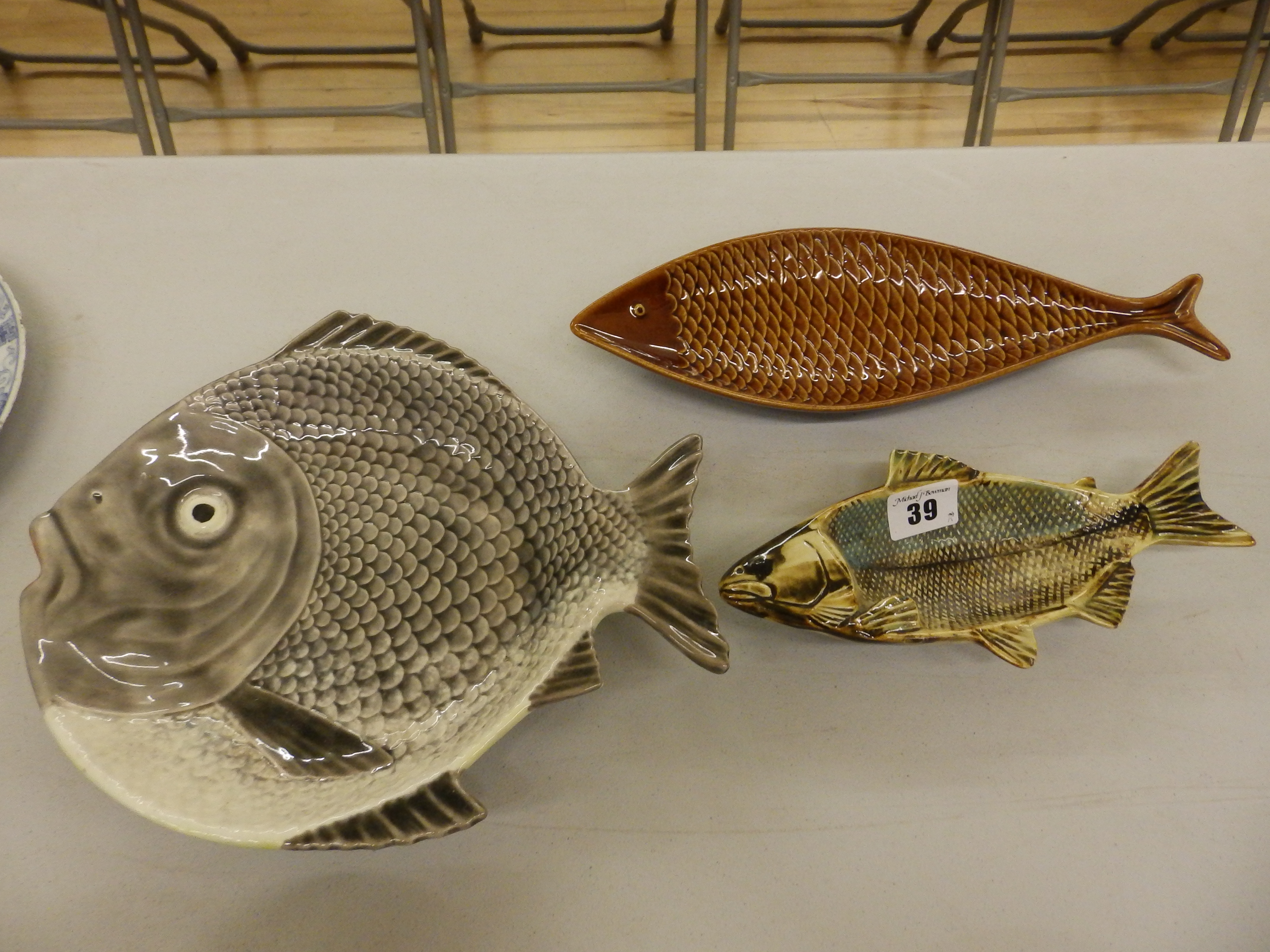 A porcelain fish tray - bearing Minton style date mark symbol and two other fish shaped trays (3)