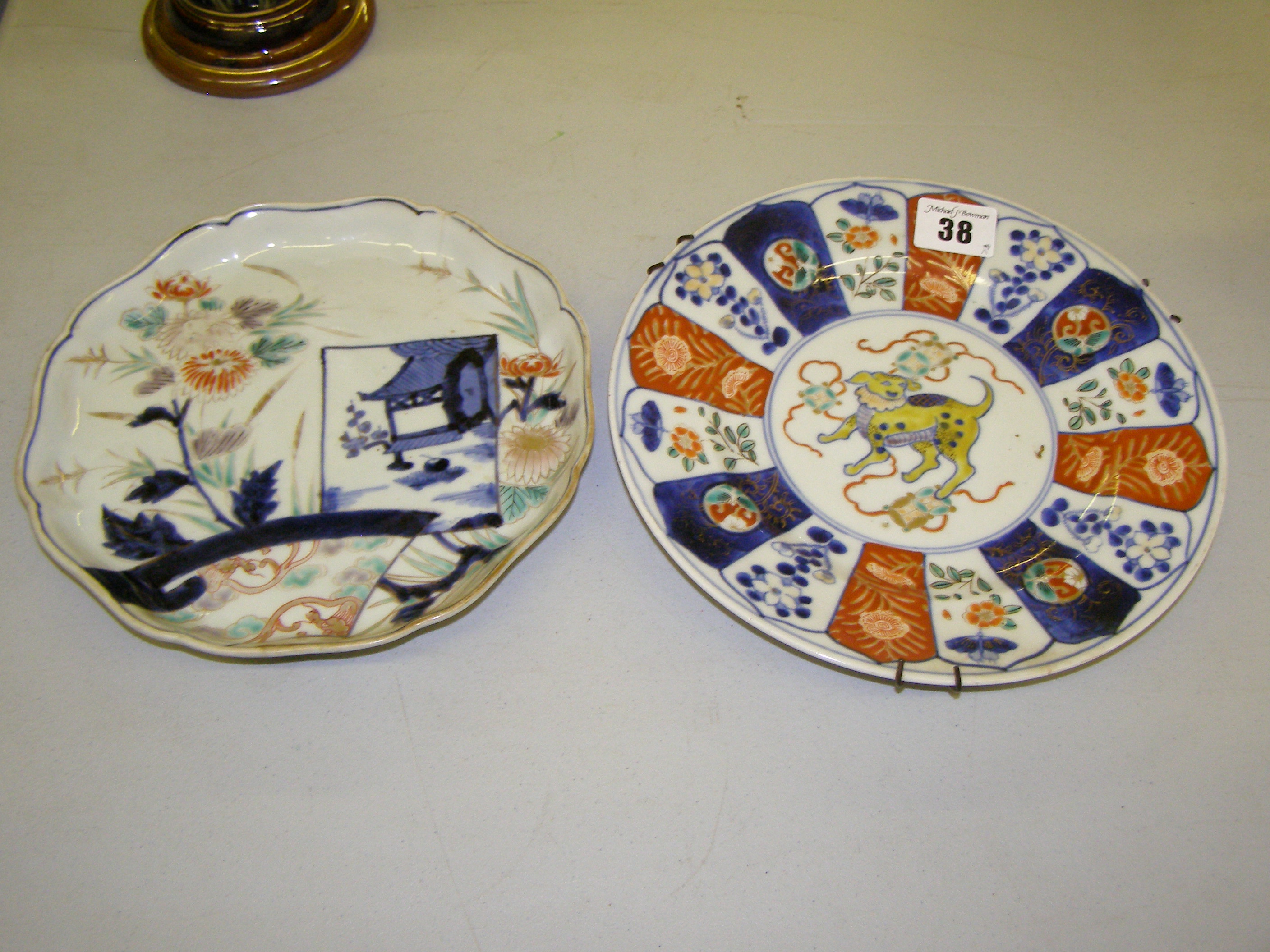 An Imari plate decorated with kylin to centre and one other (2)