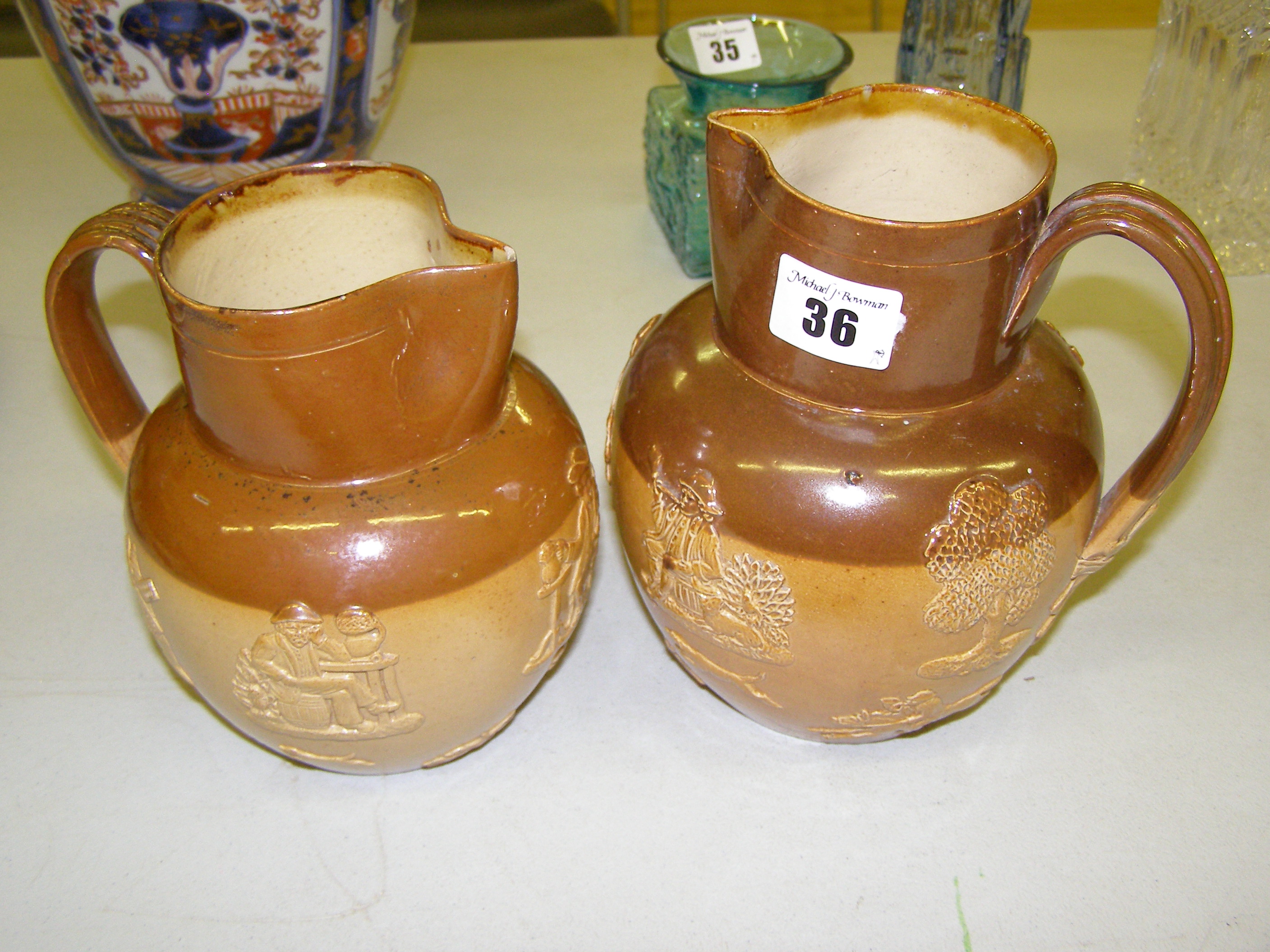 Two Doulton saltglaze jugs