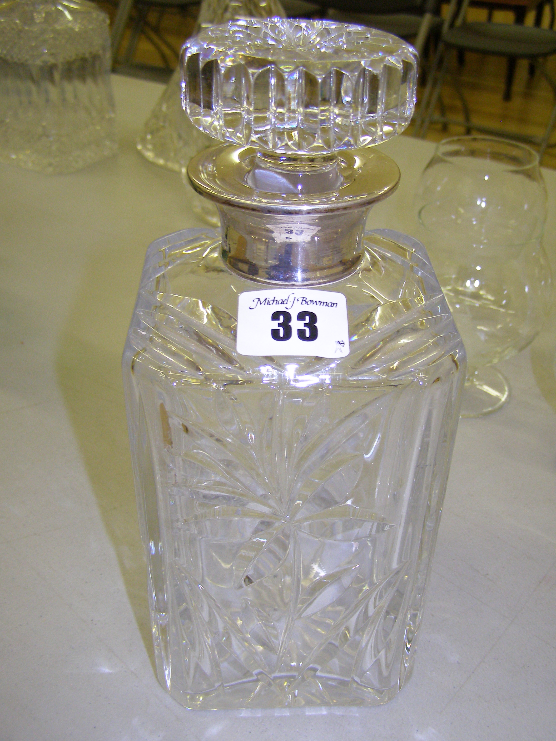 A modern silver mounted cut glass decanter