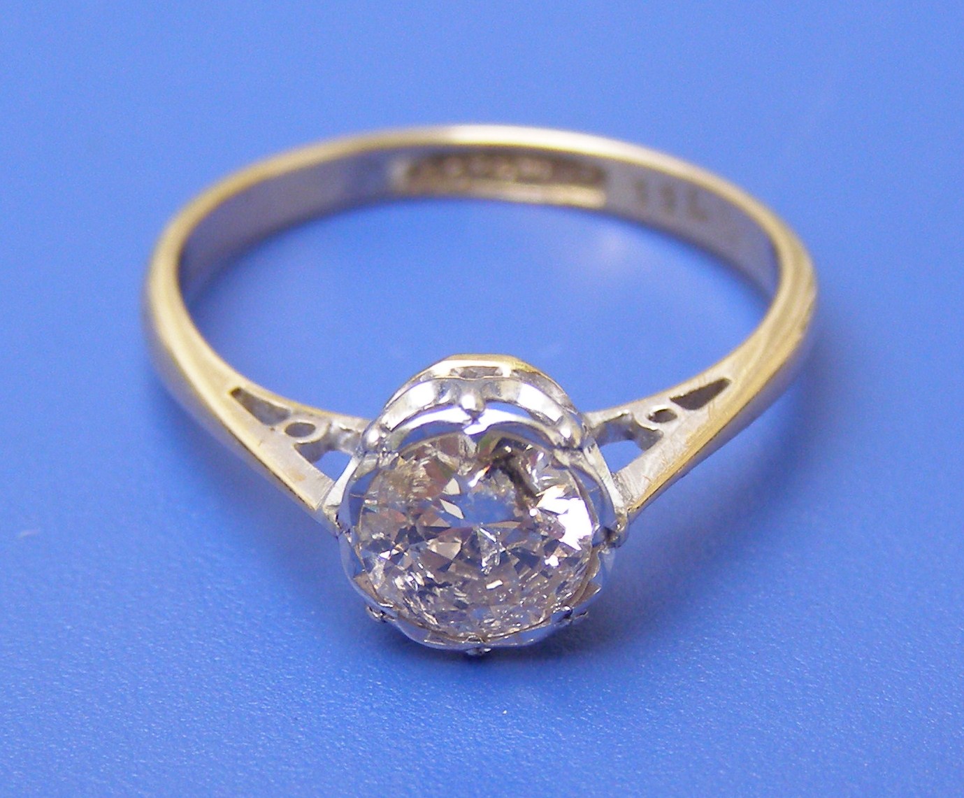 A diamond solitaire approximately one carat in shaped illusion setting ? `18ct`