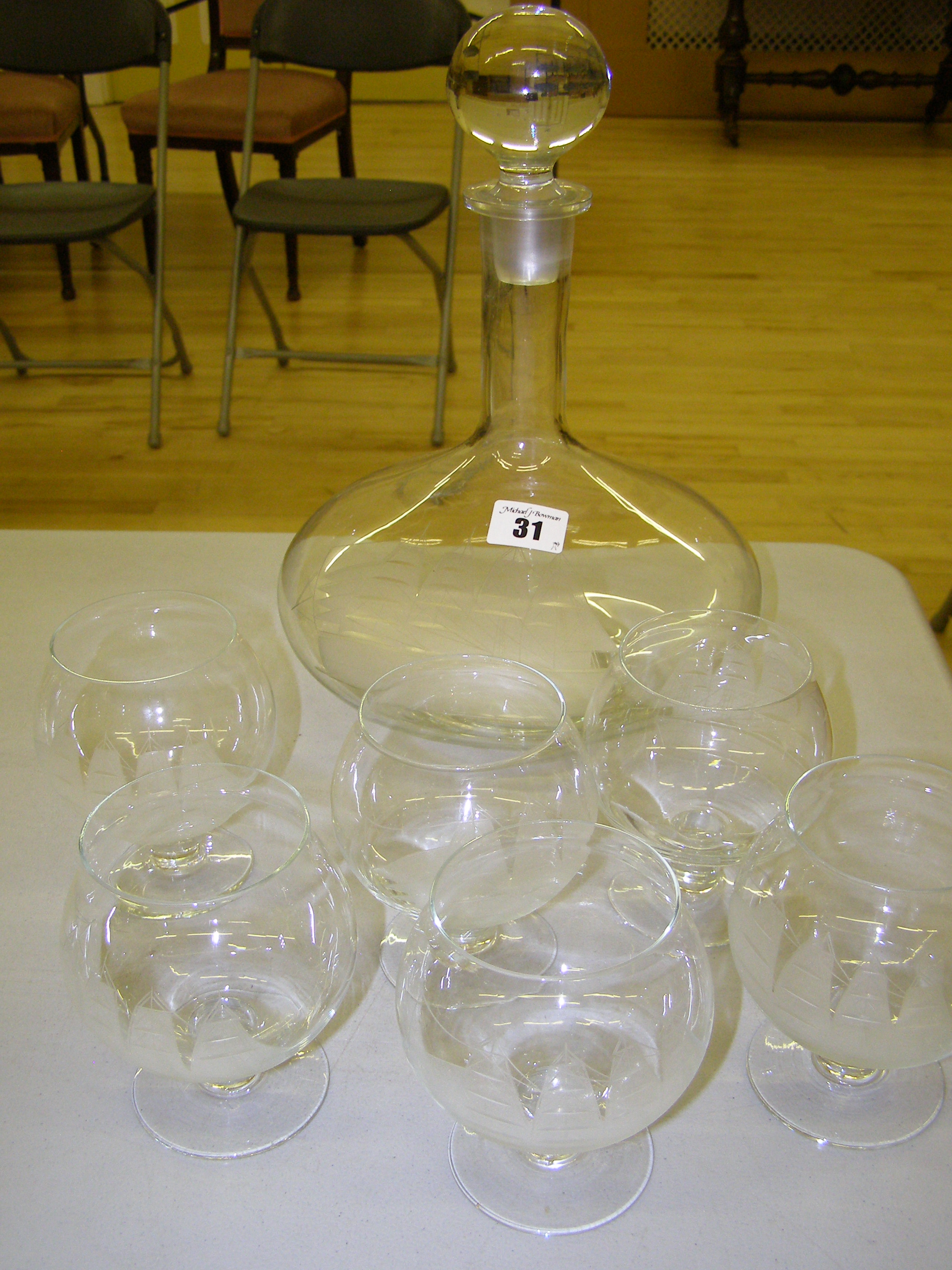 A modern ship`s decanter and six brandy glasses engraved with a ship (7)