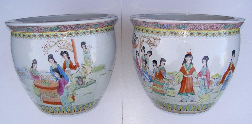 A pair of late 19th/early 20thC Chinese porcelain jaridinieres decorated female figures with three