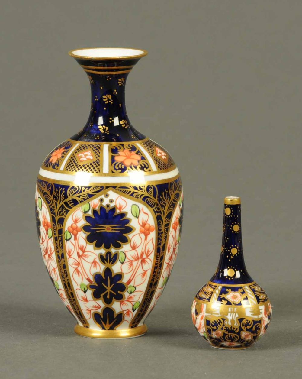Two Royal Crown Derby miniature vases.   CONDITION REPORT:  The large vase has two tiny chips to the