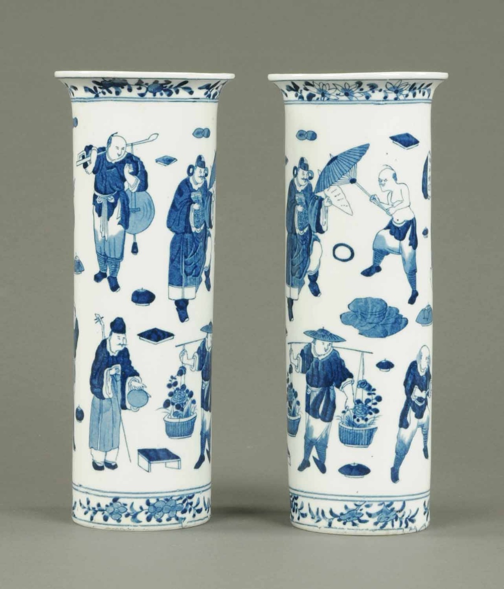 A pair of Chinese blue and white spill vases, decorated with figures, four character mark to