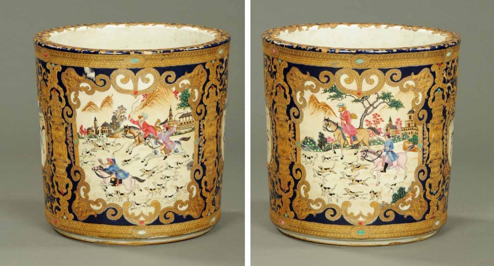 A large porcelain jardiniere, decorated with a huntsman and hounds.  Height 14.5 ins.