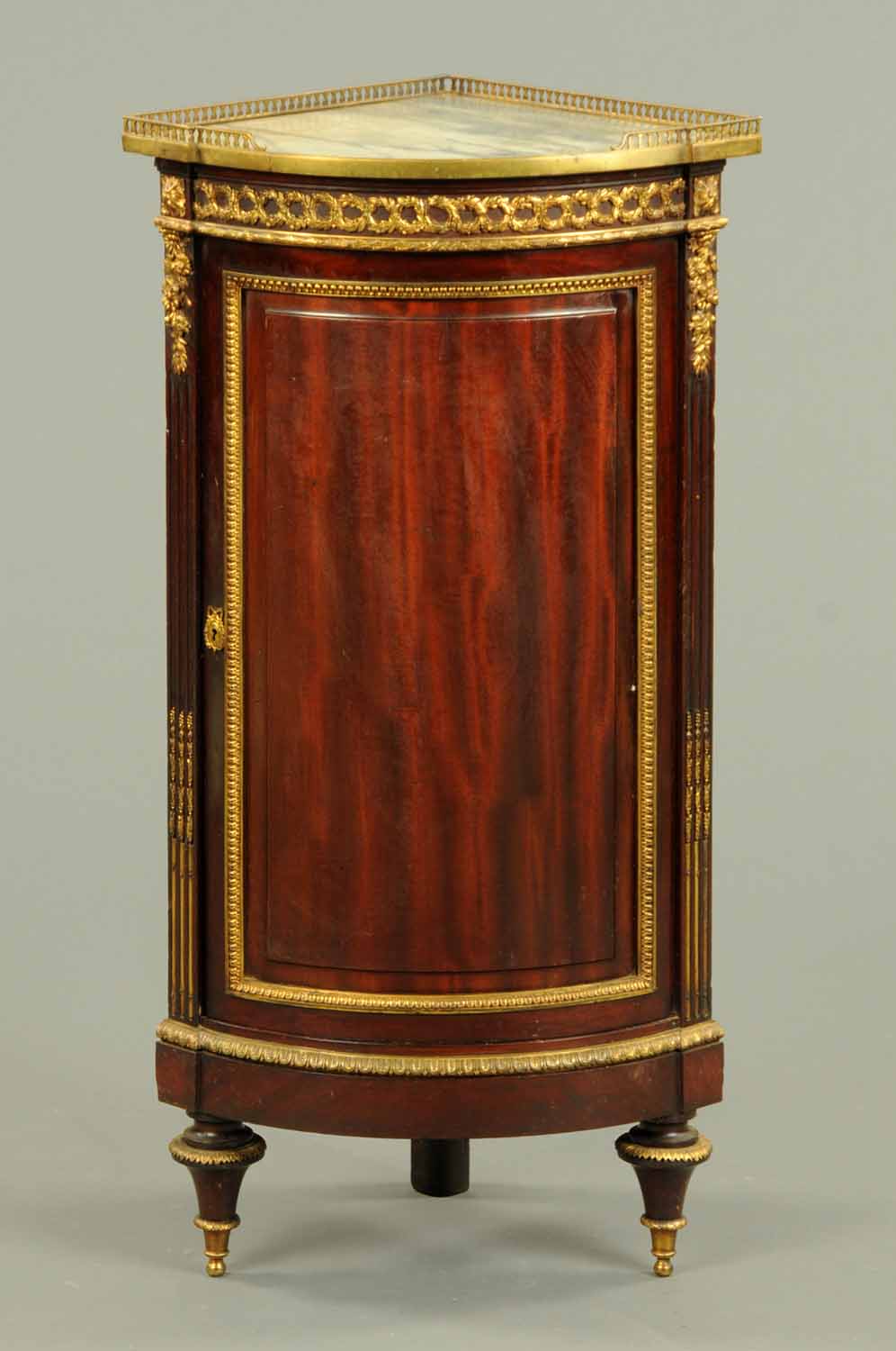 A late 19th century French mahogany corner cabinet, with marble top, by Mellier, with brass