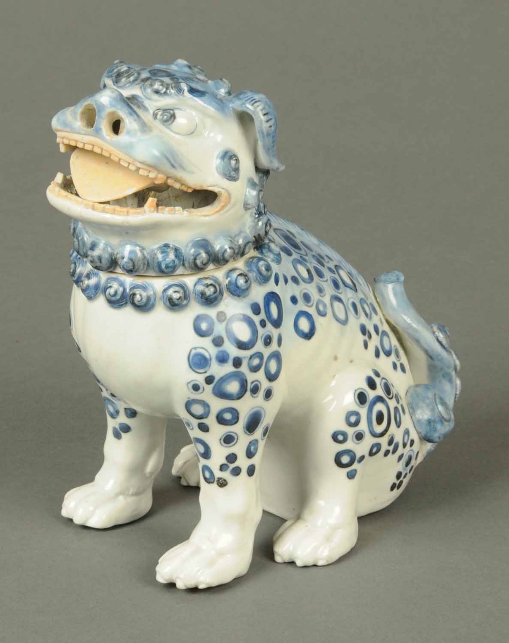 A Chinese porcelain Fo Dog potpourri holder, with detachable head, blue and white.  Height 9 ins.